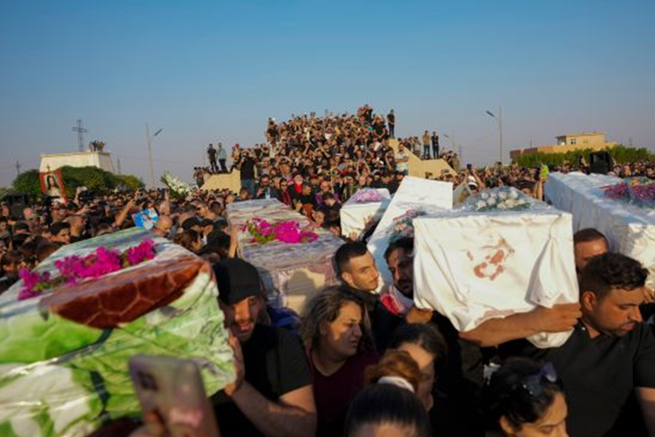 Iraq’s Nineveh buries its dead as families seek answers after wedding fire