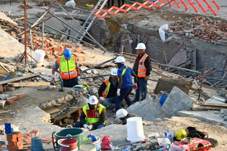 At least six killed and dozens buried by South Africa building collapse