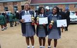 Ministry of Education awards gifts to three students who won in SADC competition.