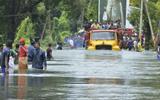 Flood water leaves rescuers with a task of hunting for dead bodies in India.