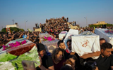 Iraq’s Nineveh buries its dead as families seek answers after wedding fire