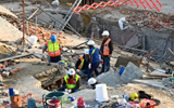 At least six killed and dozens buried by South Africa building collapse