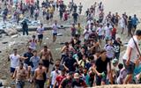 About 60,000 migrants arrive in Ceuta in 24 hours, Spanish territory's leader says